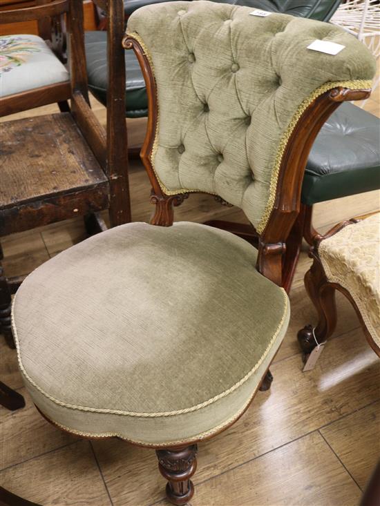 A Victorian walnut nursing chair
